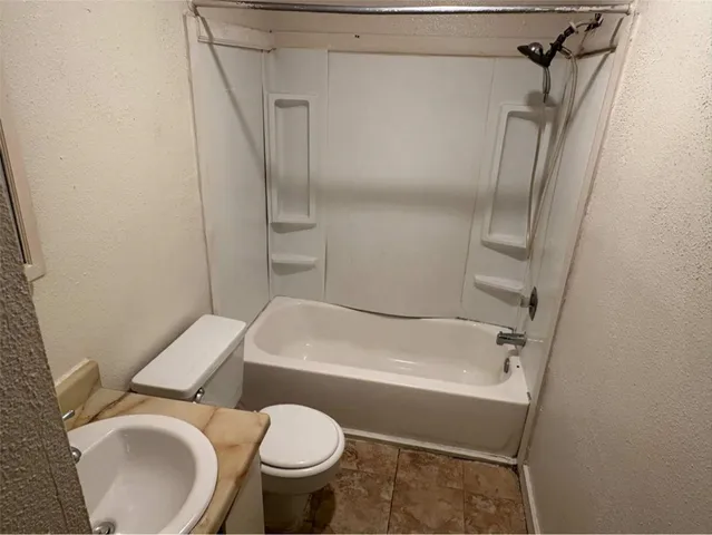 a bathroom with a sink and a toilet