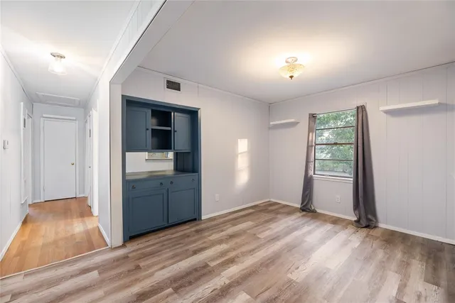 a view of a kitchen cabinets a sink and dishwasher wooden floor