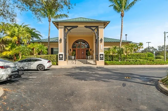 a living room with furniture and large windows