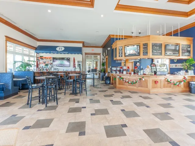 a view of a dining hall with furniture