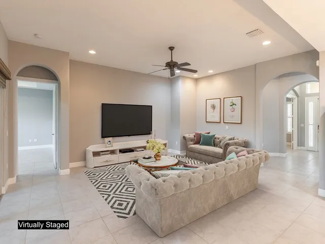 a living room with furniture and a flat screen tv