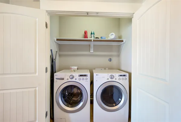 a view of storage and utility room with washer and dryer