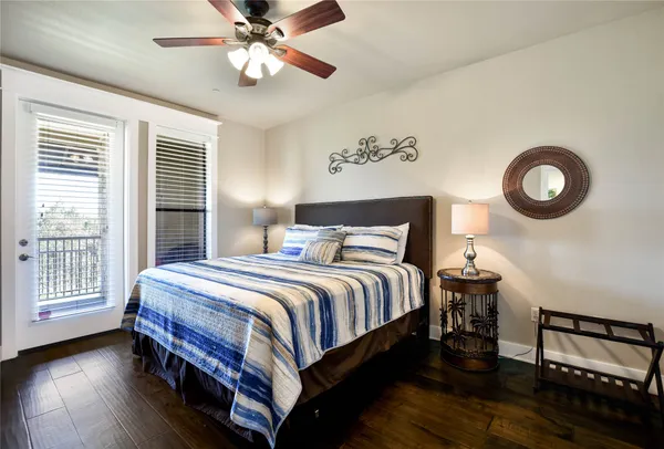 a bedroom with bed and a window