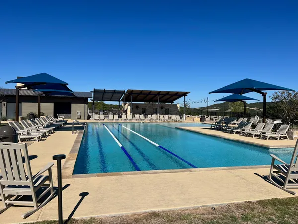 a view of swimming pool with outdoor seating