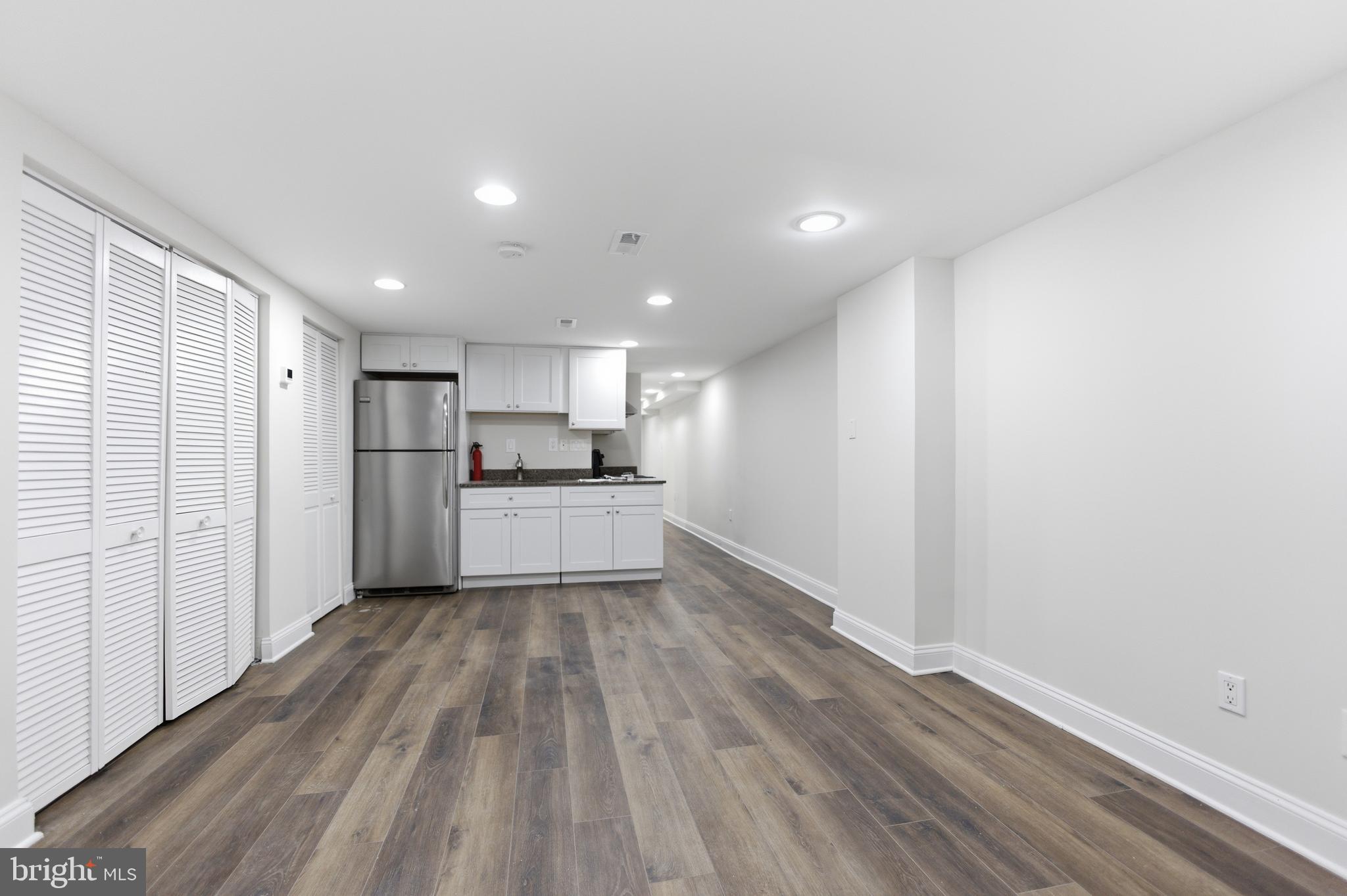 10 Girard Street Northeast Washington, DC 20002 - Photo 7 of 31 a view of kitchen with wooden floor