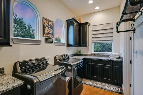 a room with furniture a flat screen tv and outdoor view
