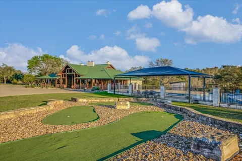 a view of a park with large trees
