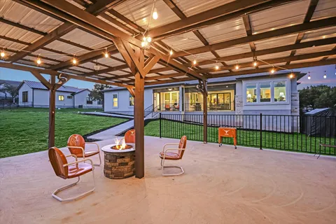 a view of a patio with a table and chairs