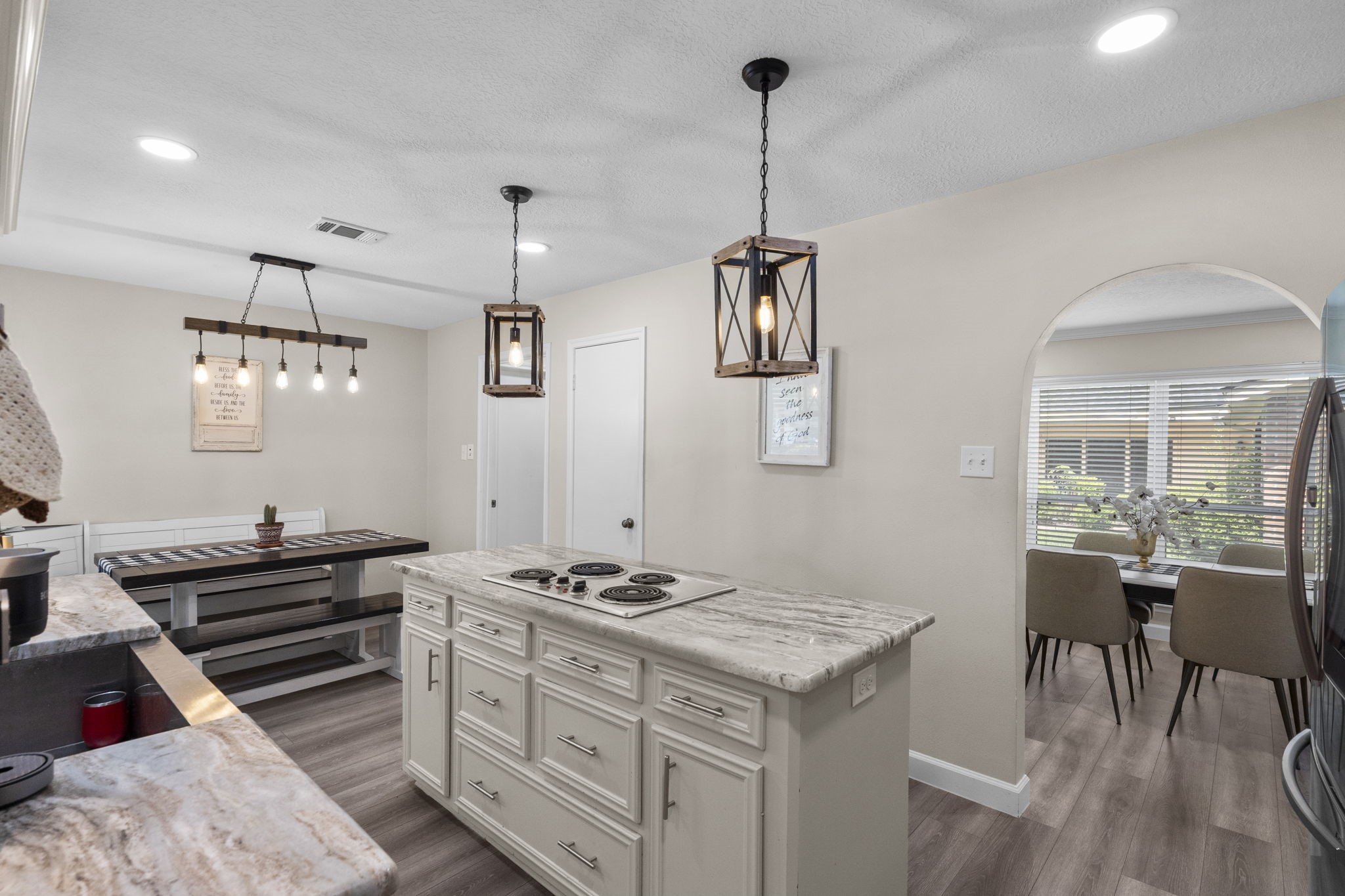 19602 Dianeshire Drive Spring, TX 77388 - Photo 15 of 37 a kitchen that has a stove a sink and a table in it