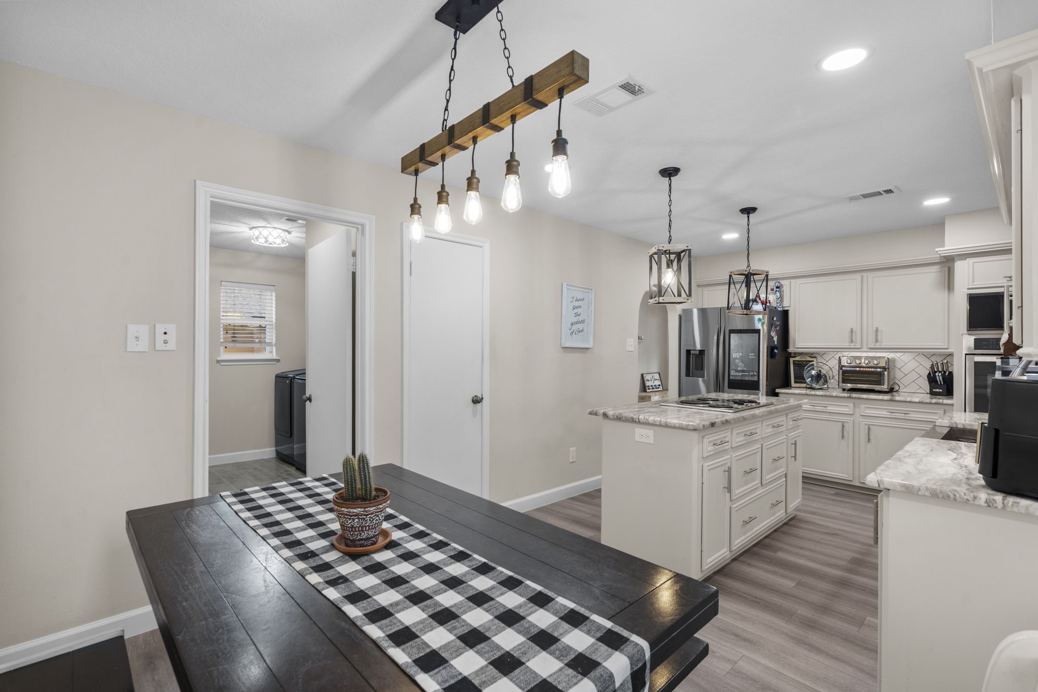 19602 Dianeshire Drive Spring, TX 77388 - Photo 19 of 37 a kitchen with granite countertop a stove a sink and a refrigerator