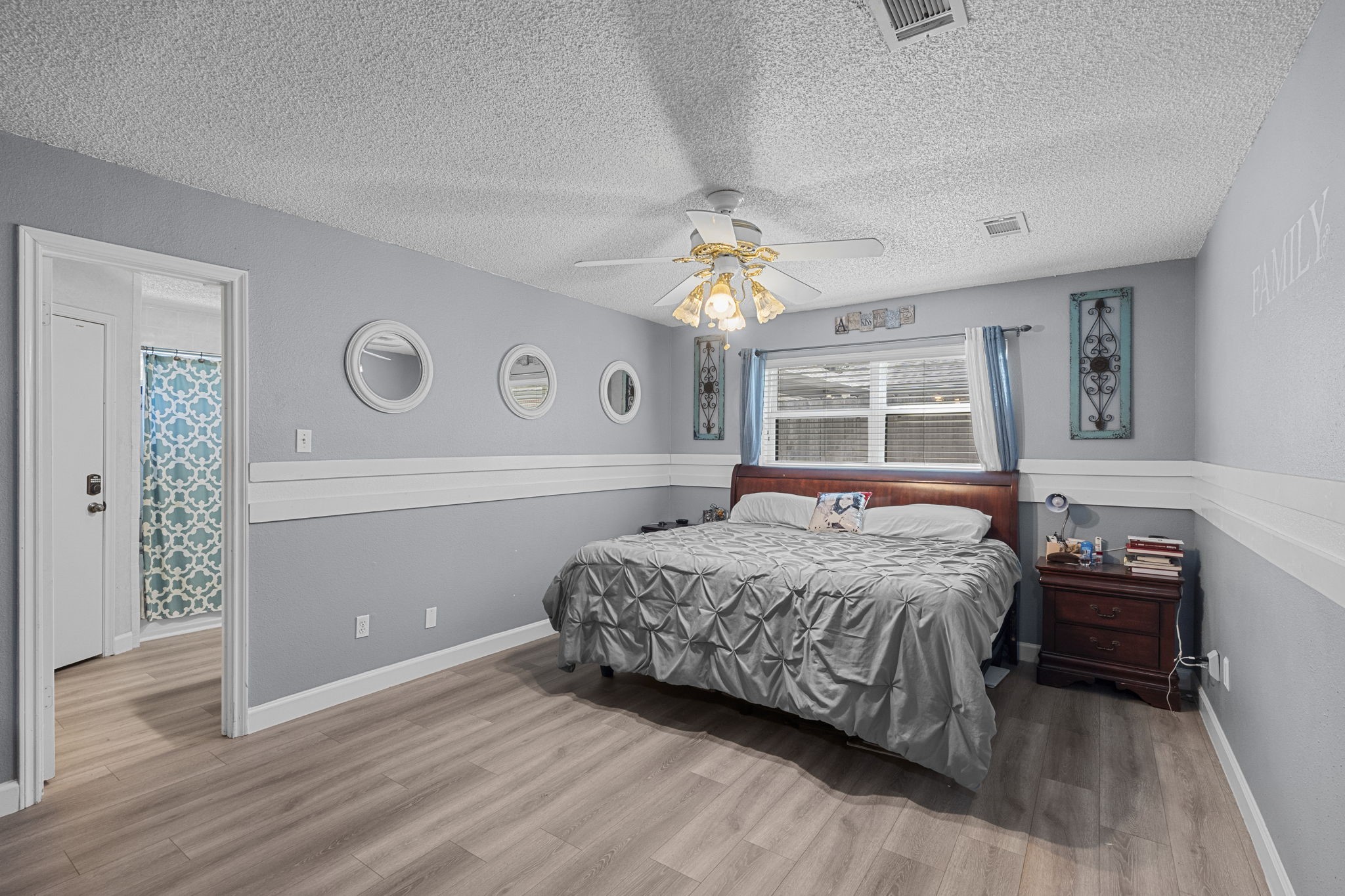 19602 Dianeshire Drive Spring, TX 77388 - Photo 23 of 37 a bedroom with a large bed and a window
