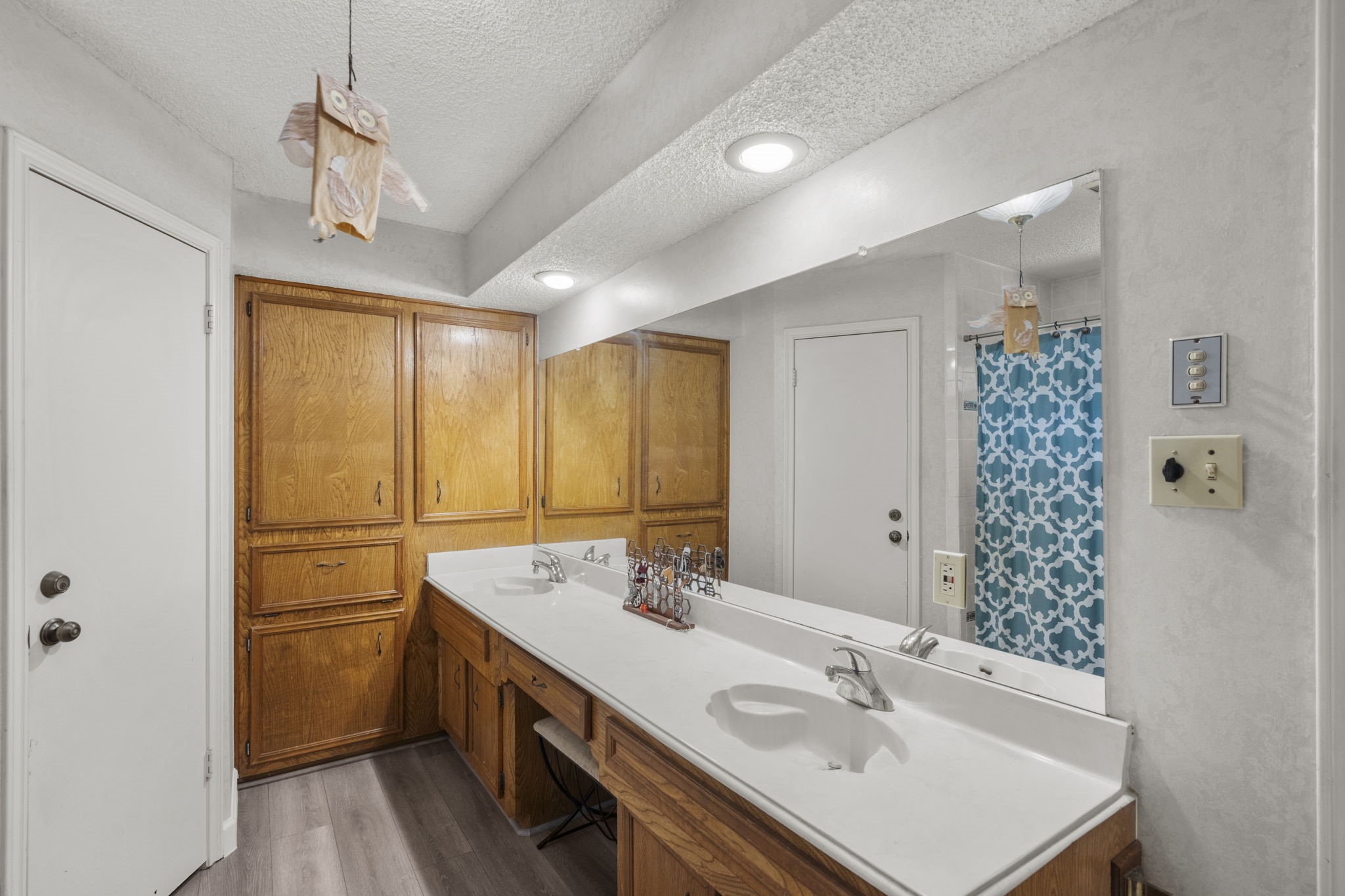 19602 Dianeshire Drive Spring, TX 77388 - Photo 27 of 37 a bathroom with a sink a vanity a mirror and a shower