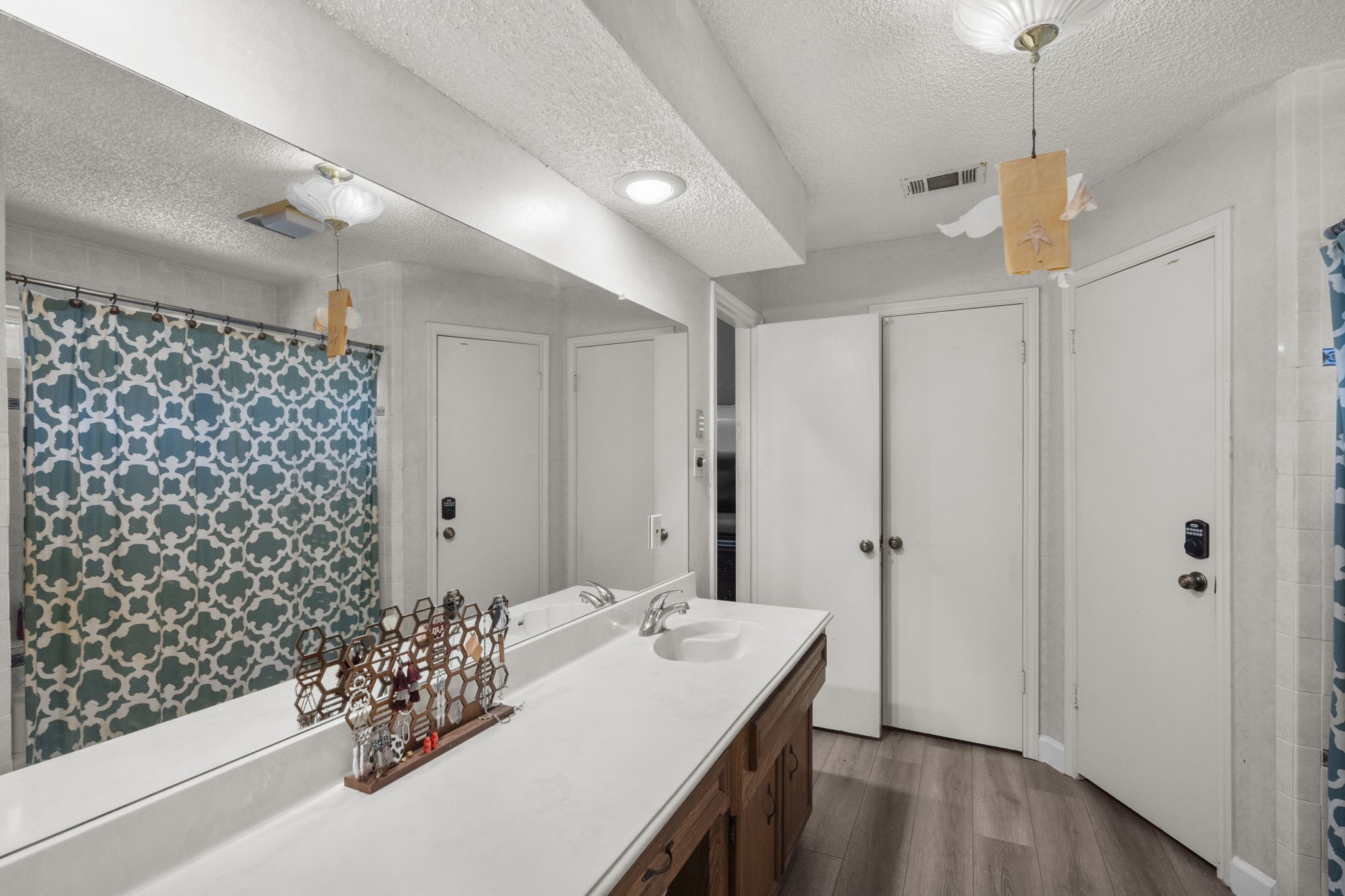 19602 Dianeshire Drive Spring, TX 77388 - Photo 28 of 37 a bathroom with a sink and a mirror