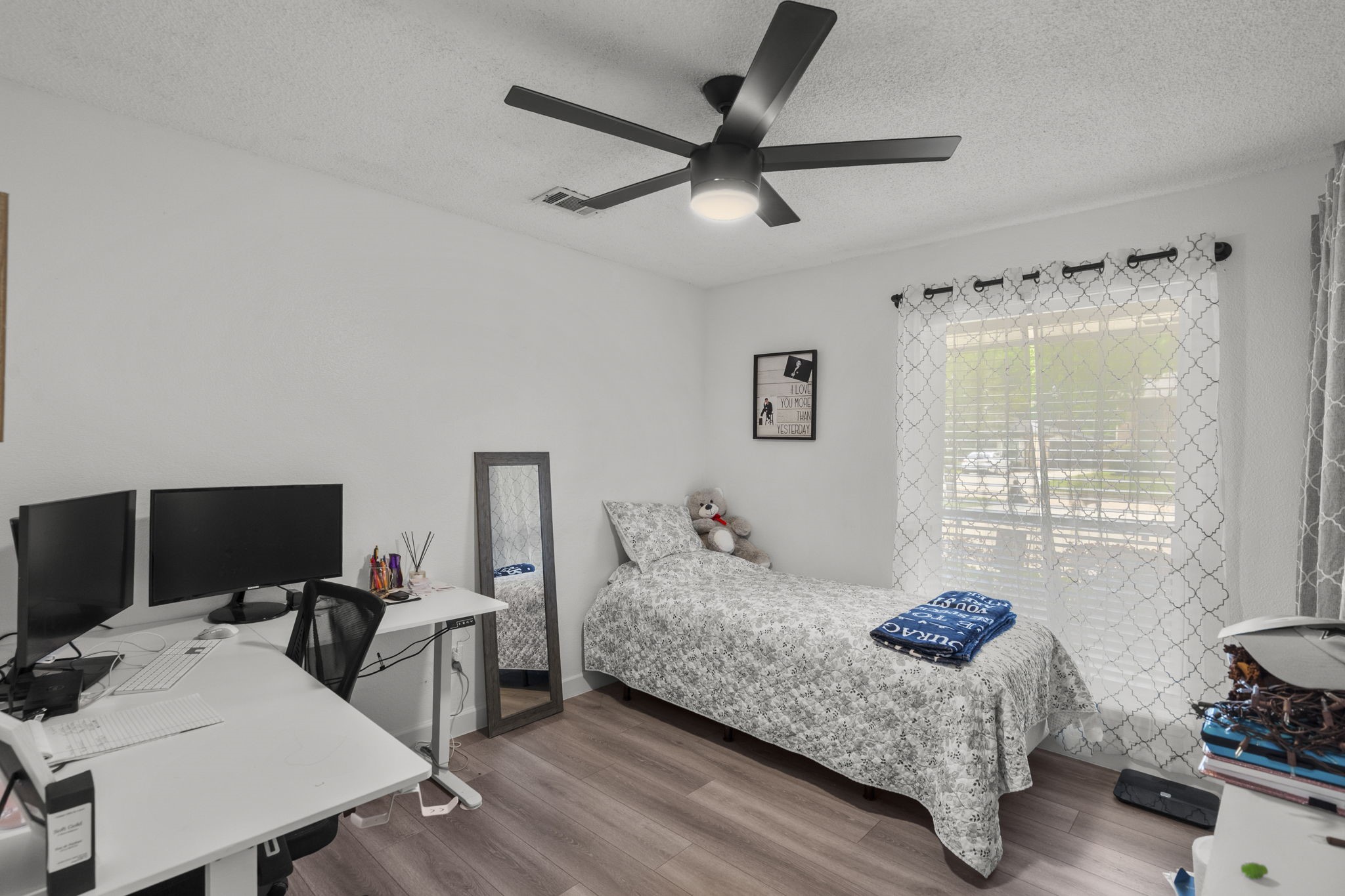 19602 Dianeshire Drive Spring, TX 77388 - Photo 29 of 37 a bedroom with a bed and a window