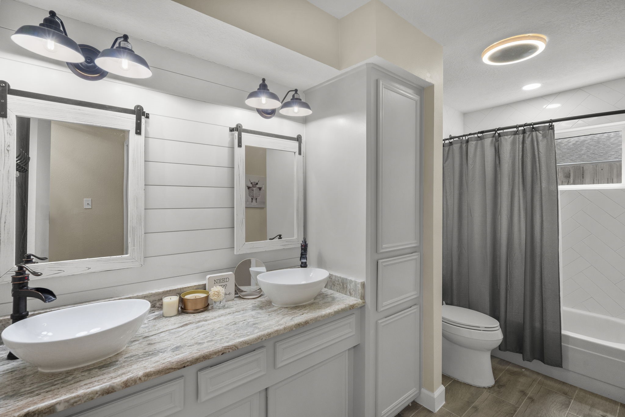 19602 Dianeshire Drive Spring, TX 77388 - Photo 31 of 37 a bathroom with a granite countertop sink toilet a large mirror and shower