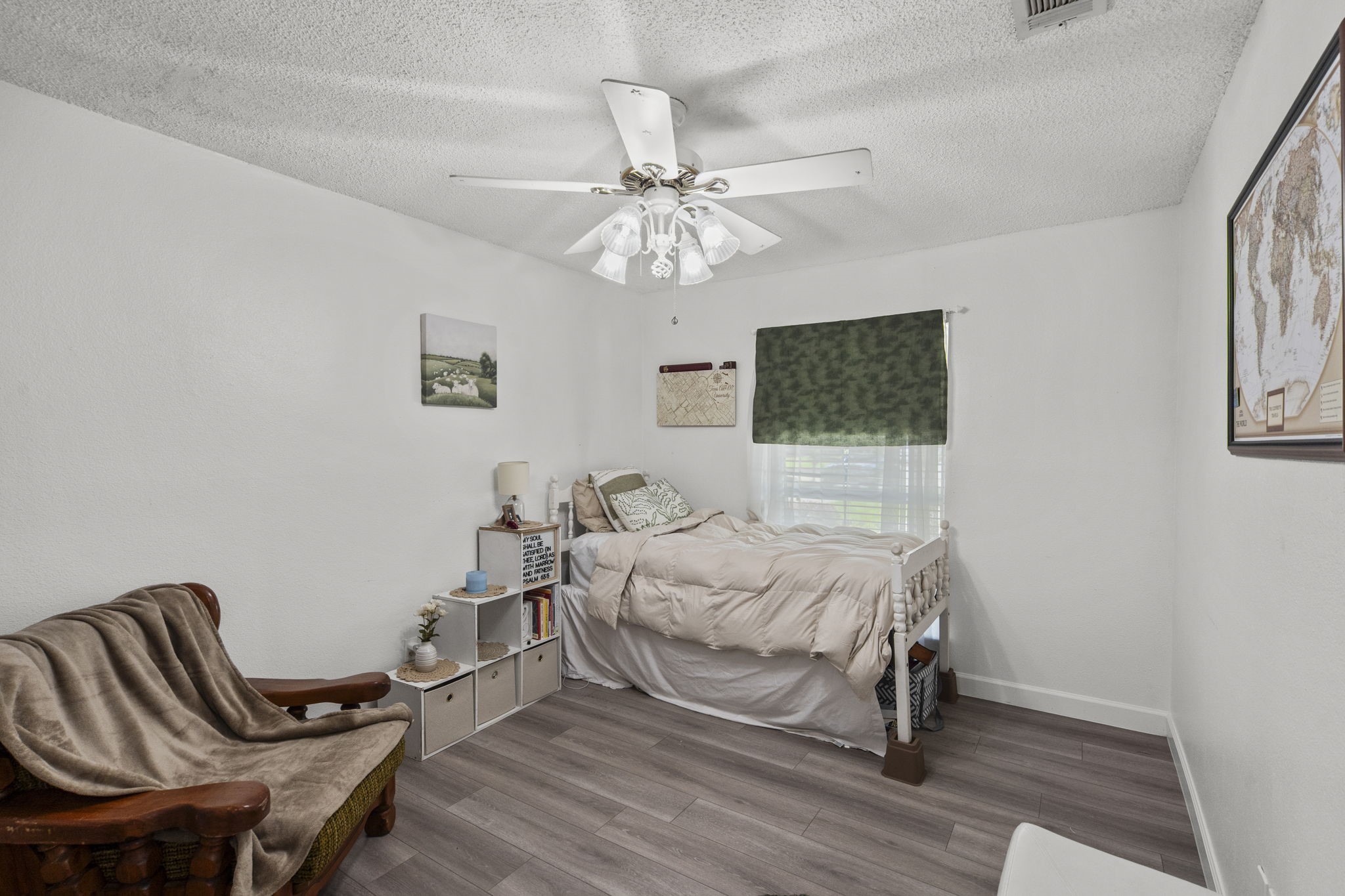 19602 Dianeshire Drive Spring, TX 77388 - Photo 32 of 37 a bedroom with a bed and a chandelier