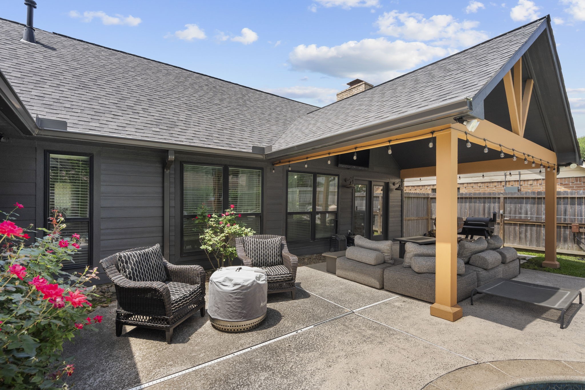 19602 Dianeshire Drive Spring, TX 77388 - Photo 35 of 37 Beautifully finished outdoor space featuring ample space for seating, vibrant landscaping and a covered patio area.
