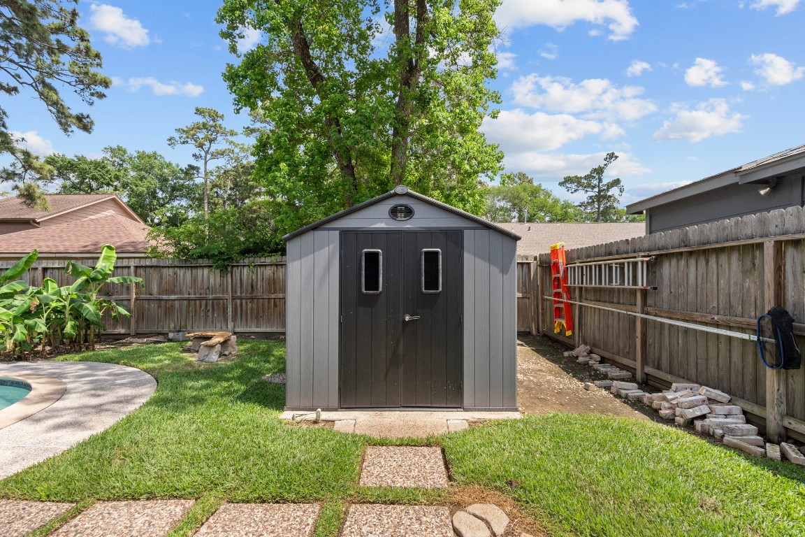 19602 Dianeshire Drive Spring, TX 77388 - Photo 37 of 37 Modern storage shed for additional outdoor organizational space.