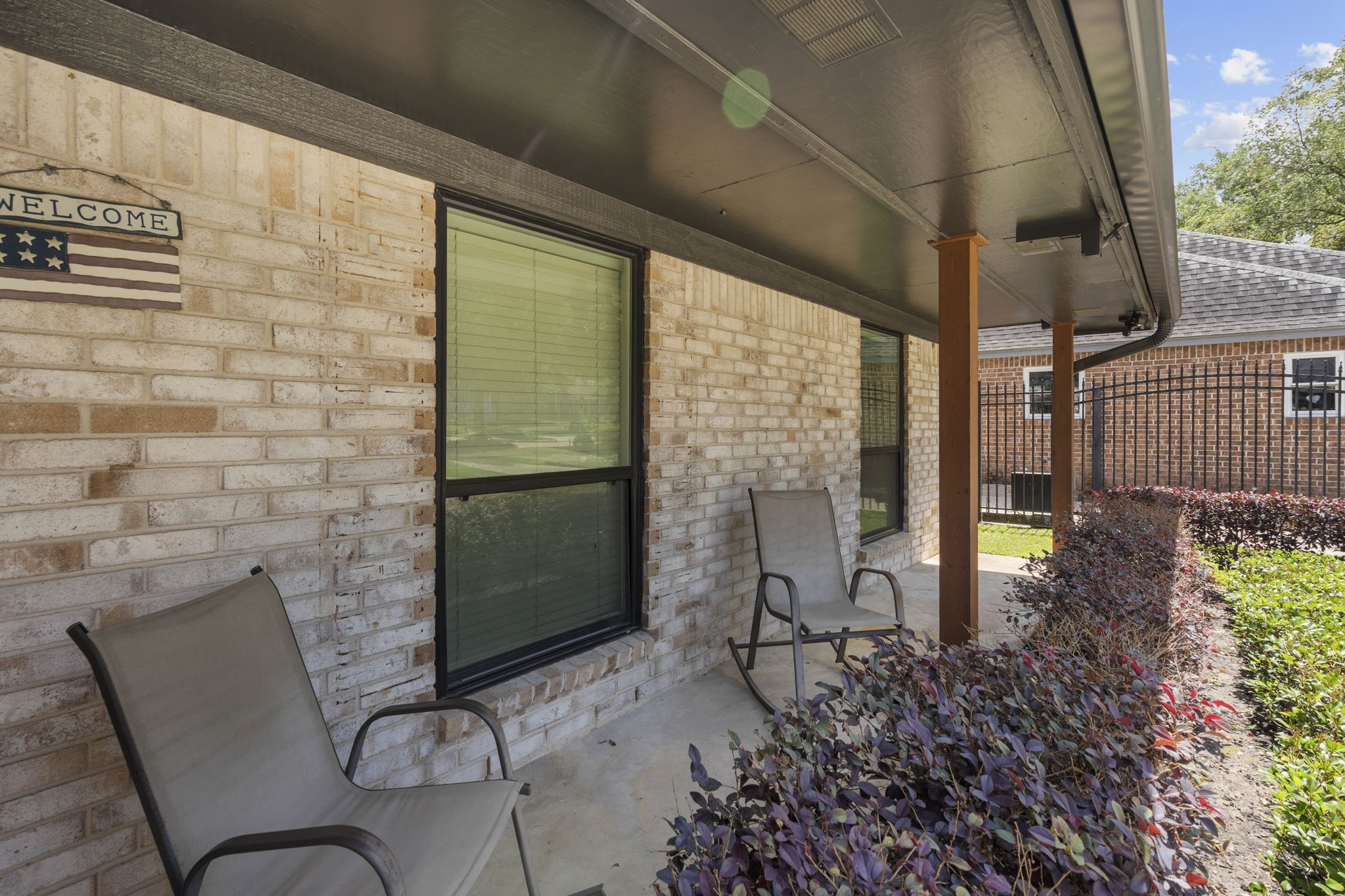 19602 Dianeshire Drive Spring, TX 77388 - Photo 7 of 37 Charming front porch with two chairs and a lovely brick exterior.