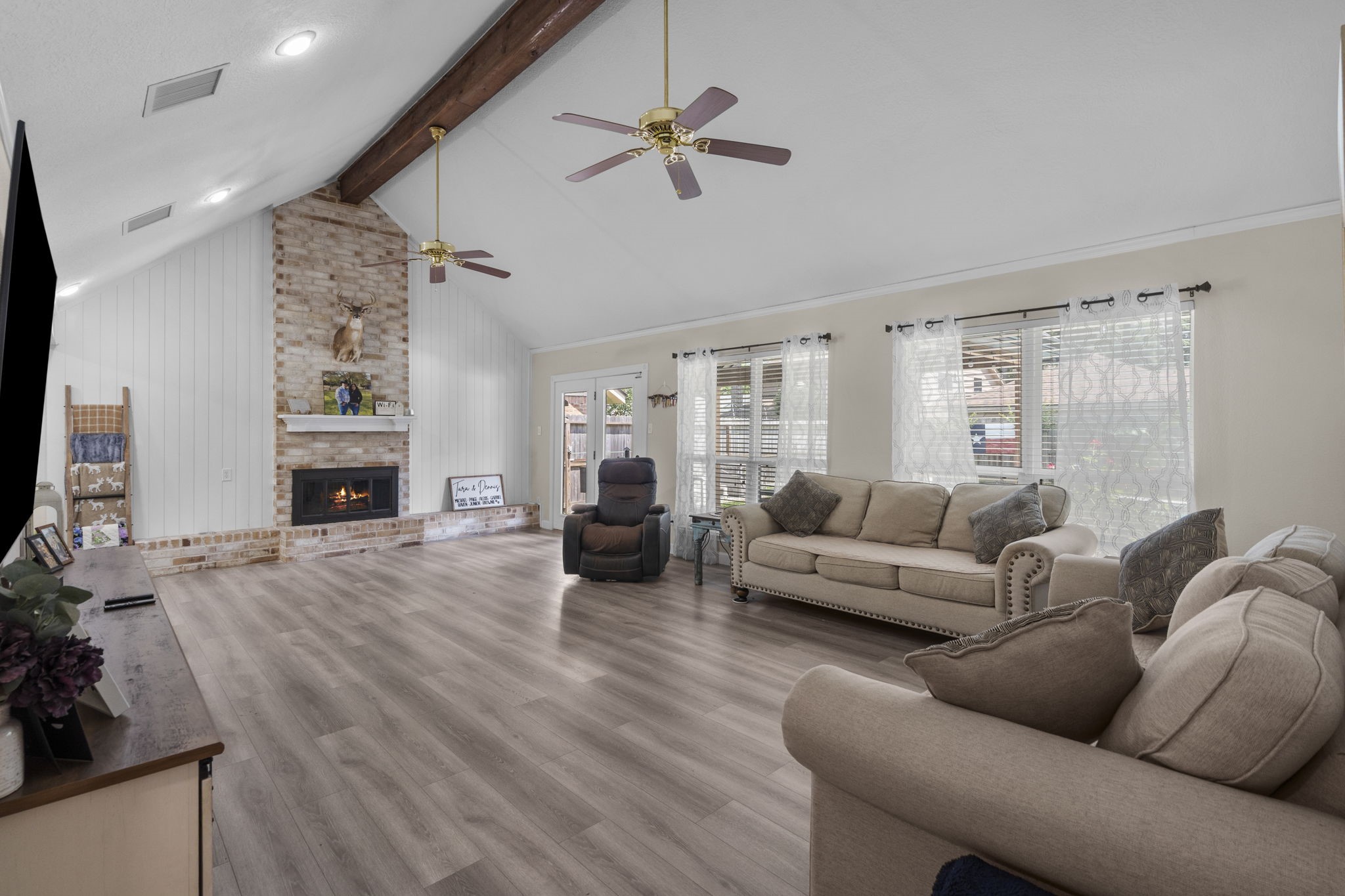 19602 Dianeshire Drive Spring, TX 77388 - Photo 9 of 37 a living room with furniture fireplace and a flat screen tv