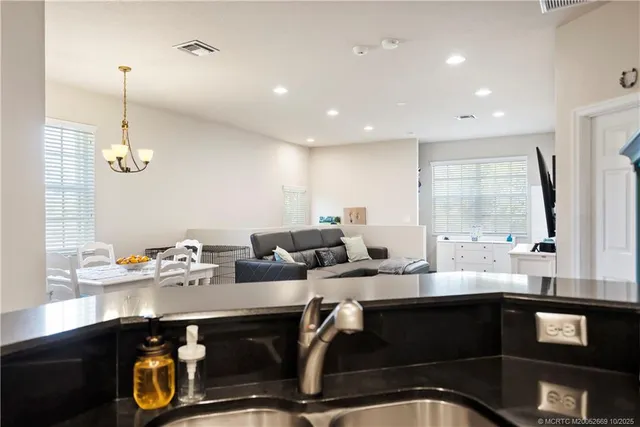 a kitchen with a sink stainless steel appliances and cabinets