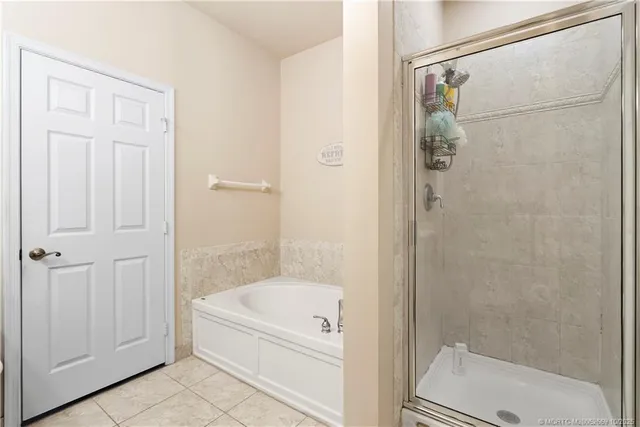 a bathroom with a bathtub and a shower