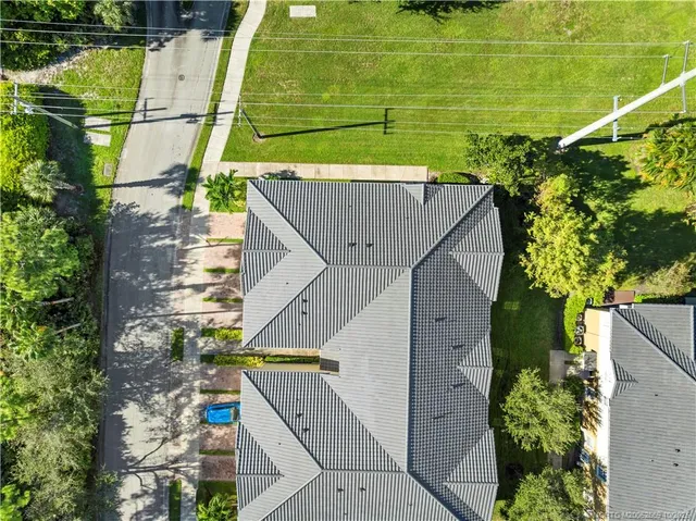 an aerial view of a house with a garden