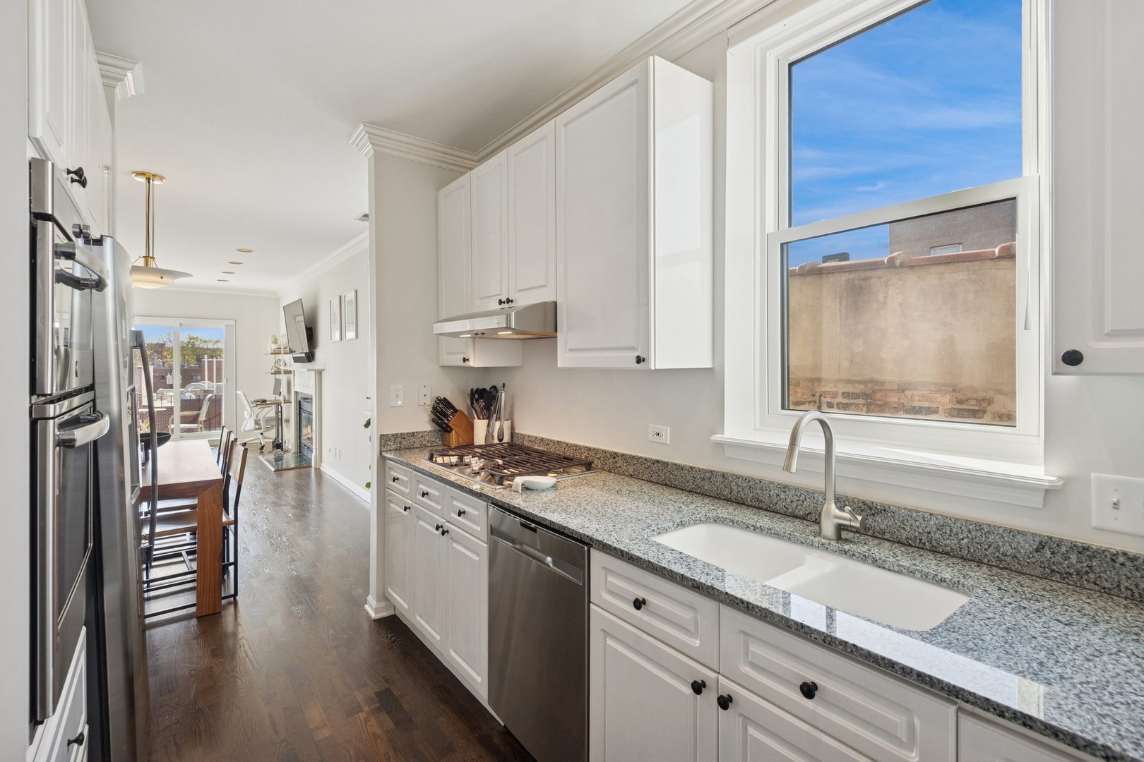 1122 West Armitage Avenue, Unit 302 Chicago, IL 60614 - Photo 12 of 23 a kitchen with a sink stove and refrigerator