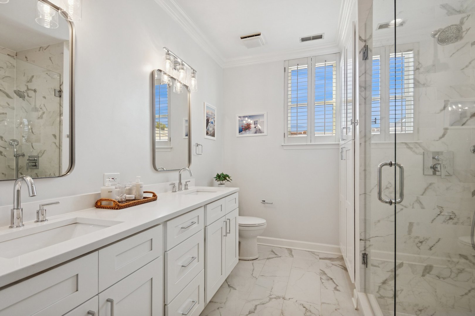 1122 West Armitage Avenue, Unit 302 Chicago, IL 60614 - Photo 16 of 23 a bathroom with a double vanity sink toilet and shower