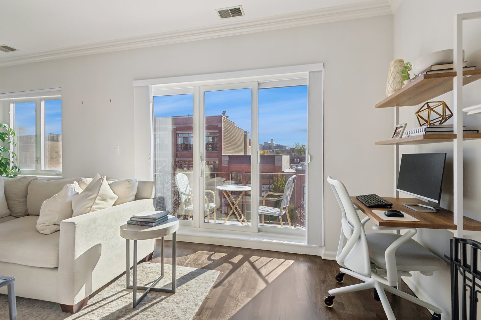 1122 West Armitage Avenue, Unit 302 Chicago, IL 60614 - Photo 5 of 23 a living room with furniture and a flat screen tv