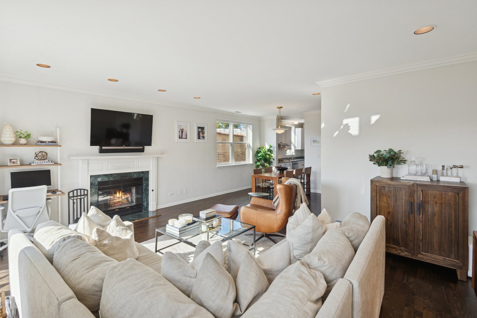 1122 West Armitage Avenue, Unit 302 Chicago, IL 60614 - Photo 7 of 23 a living room with furniture a fireplace and a flat screen tv