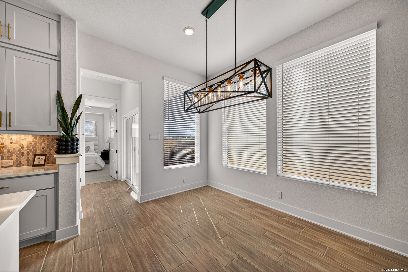 20675 Huebner Road, Unit 527 San Antonio, TX 78258 - Photo 15 of 33 a view of an empty room with wooden floor and a window