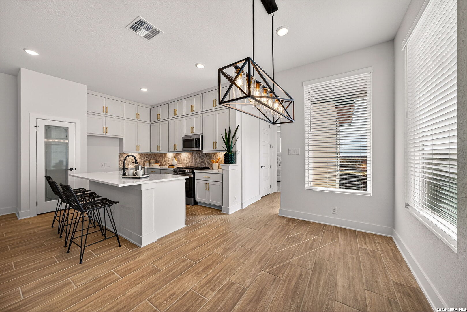 20675 Huebner Road, Unit 527 San Antonio, TX 78258 - Photo 16 of 33 a view of kitchen with sink and wooden floor