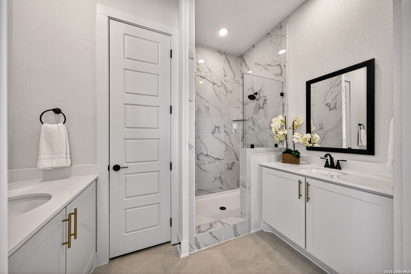 20675 Huebner Road, Unit 527 San Antonio, TX 78258 - Photo 20 of 33 a bathroom with a double vanity sink mirror and shower