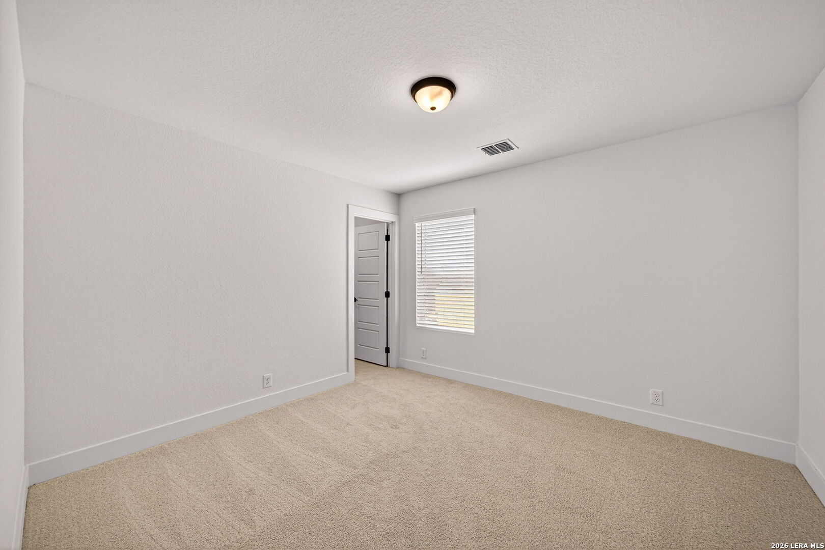 20675 Huebner Road, Unit 527 San Antonio, TX 78258 - Photo 23 of 33 a view of an empty room with a window