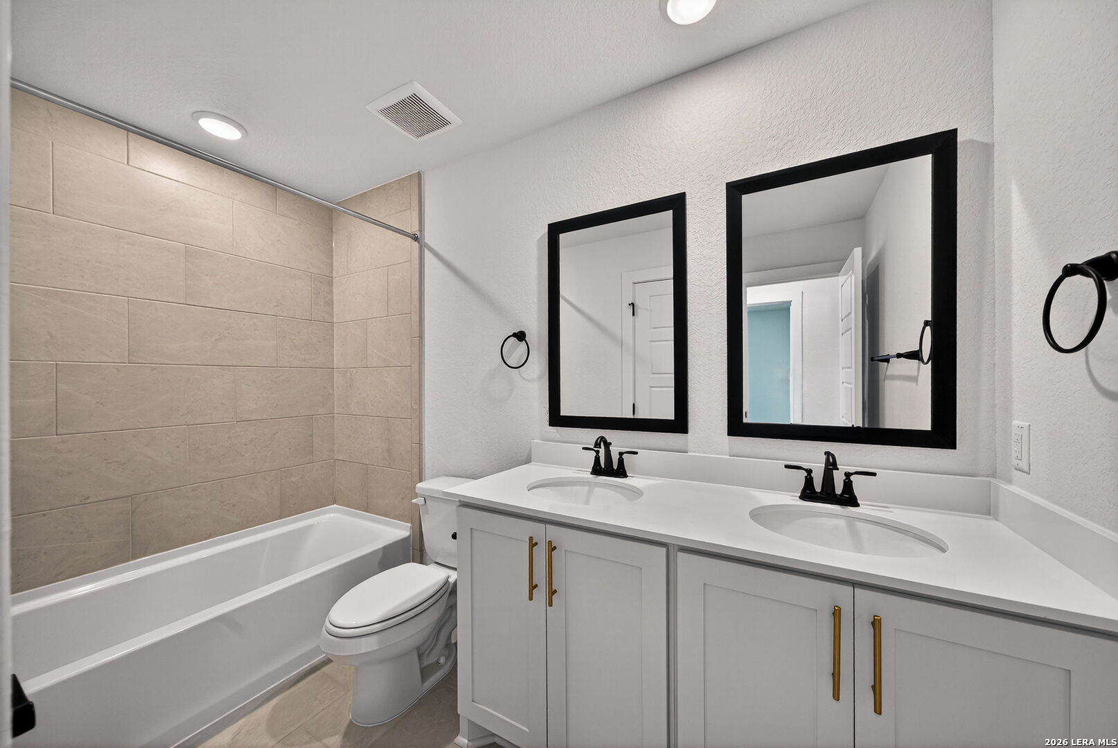 20675 Huebner Road, Unit 527 San Antonio, TX 78258 - Photo 25 of 33 a bathroom with a granite countertop sink a toilet and shower