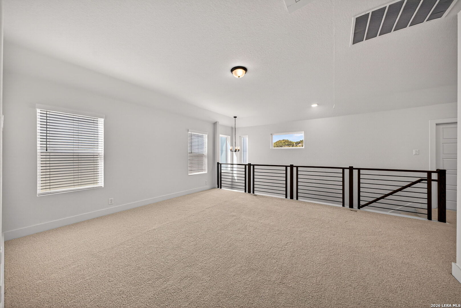 20675 Huebner Road, Unit 527 San Antonio, TX 78258 - Photo 26 of 33 a view of an empty room with stairs