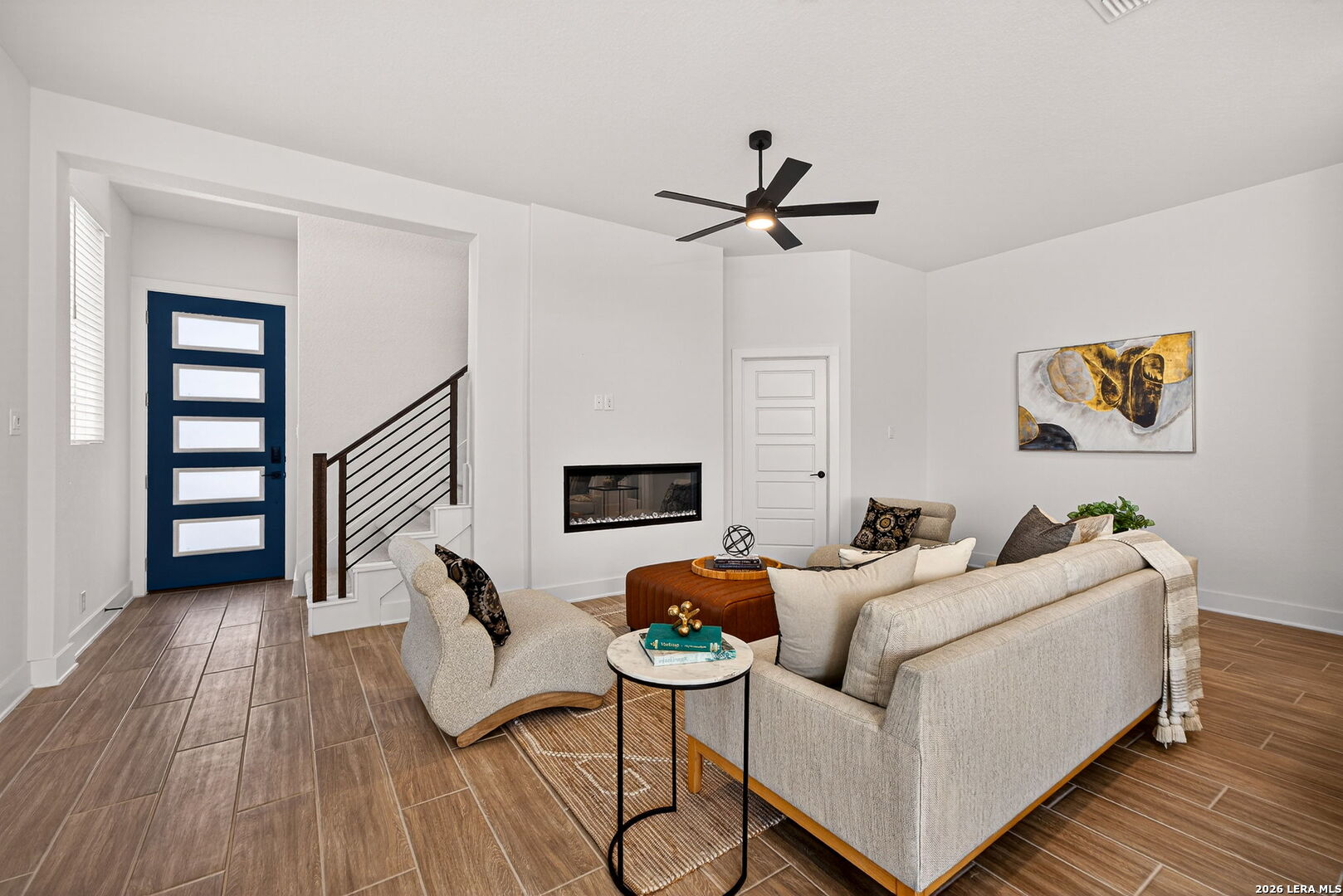 20675 Huebner Road, Unit 527 San Antonio, TX 78258 - Photo 9 of 33 a living room with furniture and a wooden floor