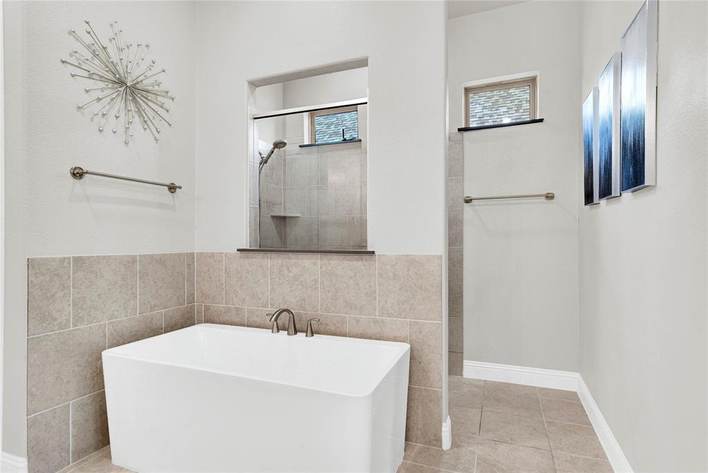 616 Windy Ridge Lane Rockwall, TX 75087 - Photo 11 of 25 a bathroom with a sink and mirror