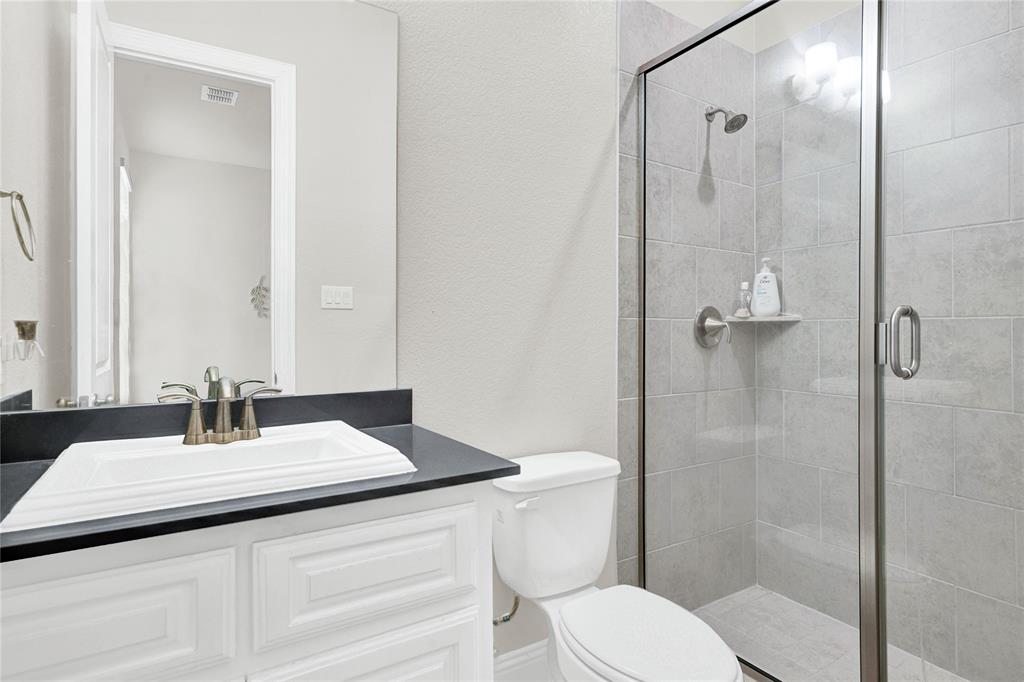 616 Windy Ridge Lane Rockwall, TX 75087 - Photo 13 of 25 a bathroom with a sink toilet and shower