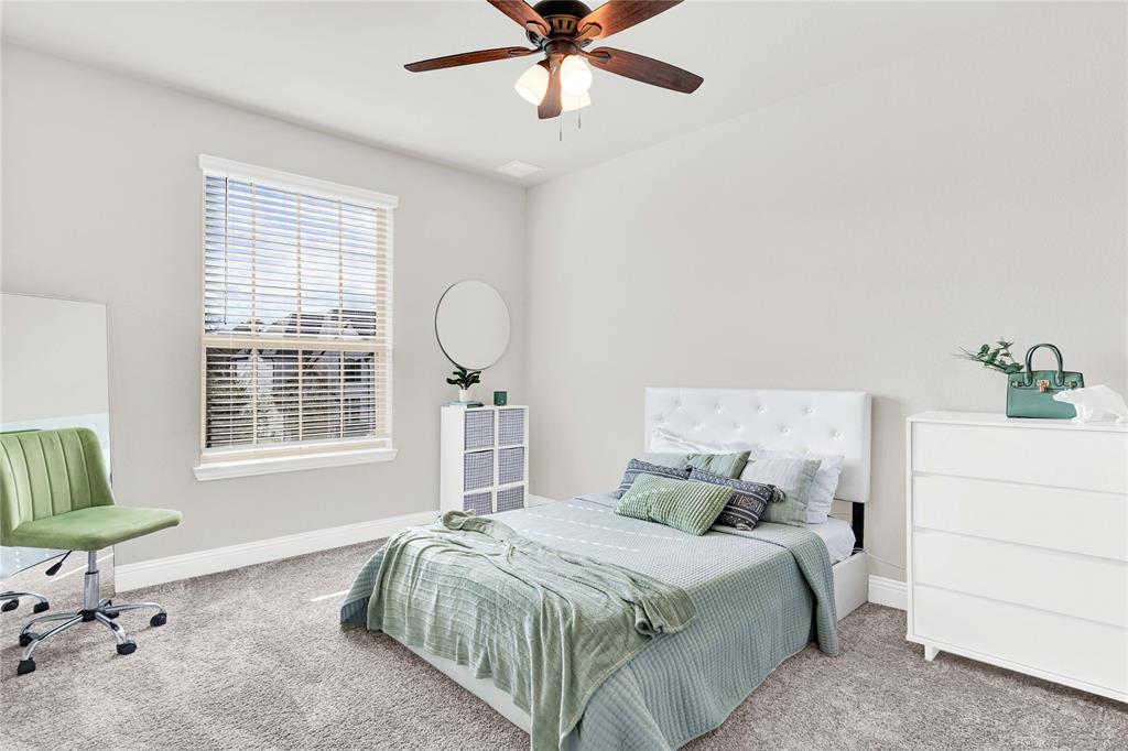 616 Windy Ridge Lane Rockwall, TX 75087 - Photo 16 of 25 a bedroom with a bed and a window