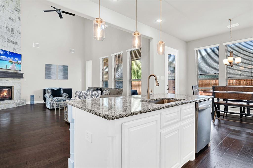 616 Windy Ridge Lane Rockwall, TX 75087 - Photo 25 of 25 a kitchen with center island table and chairs