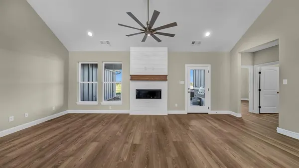 a view of livingroom with hardwood floor and a ceiling fan