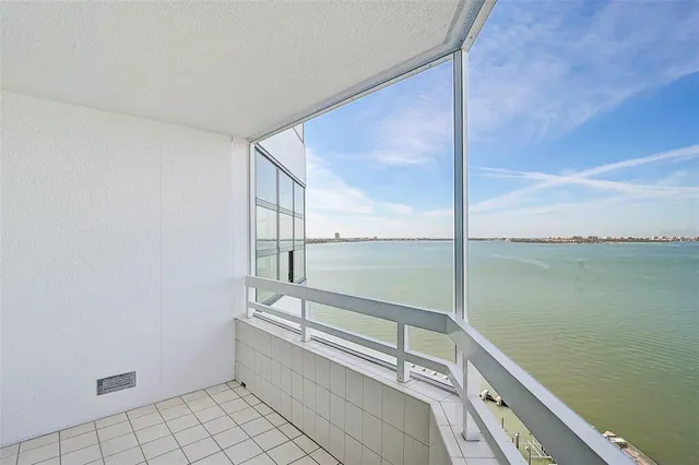 an empty room with a empty space and windows