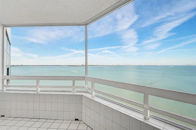 a view of a livingroom with cabinet and a large window