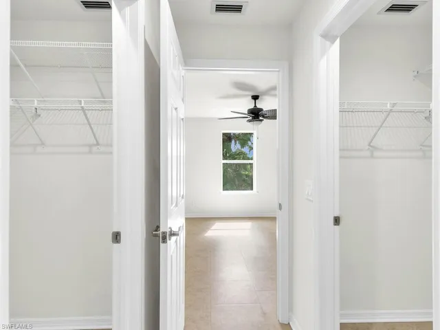 a view of kitchen with windows and cabinet