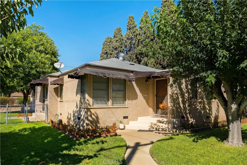 4693 Beatty Drive Riverside, CA 92506 - Photo 1 of 1 a front view of a house with garden