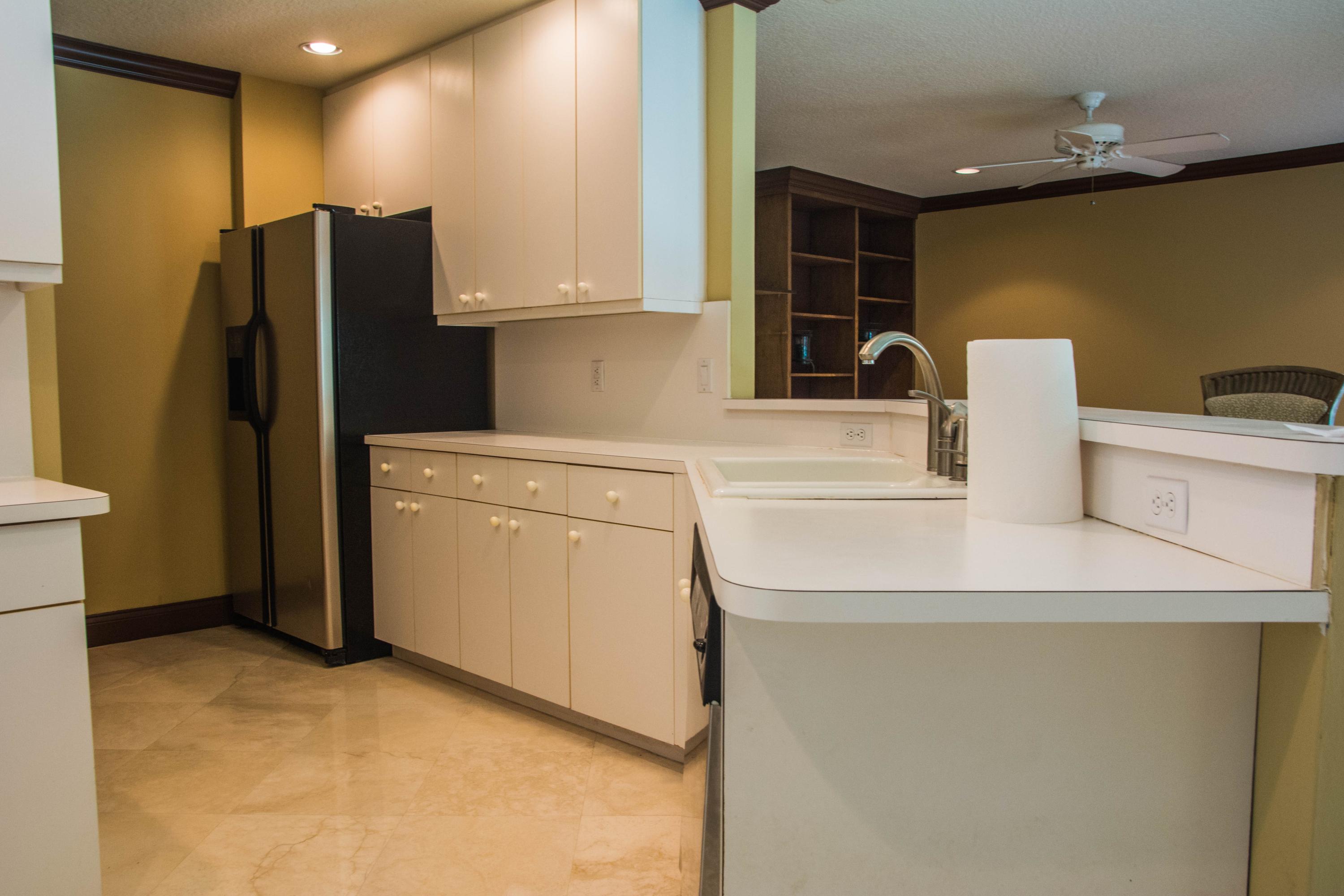 17234 Ventana Drive Boca Raton, FL 33487 - Photo 11 of 27 a kitchen with a refrigerator sink and stove