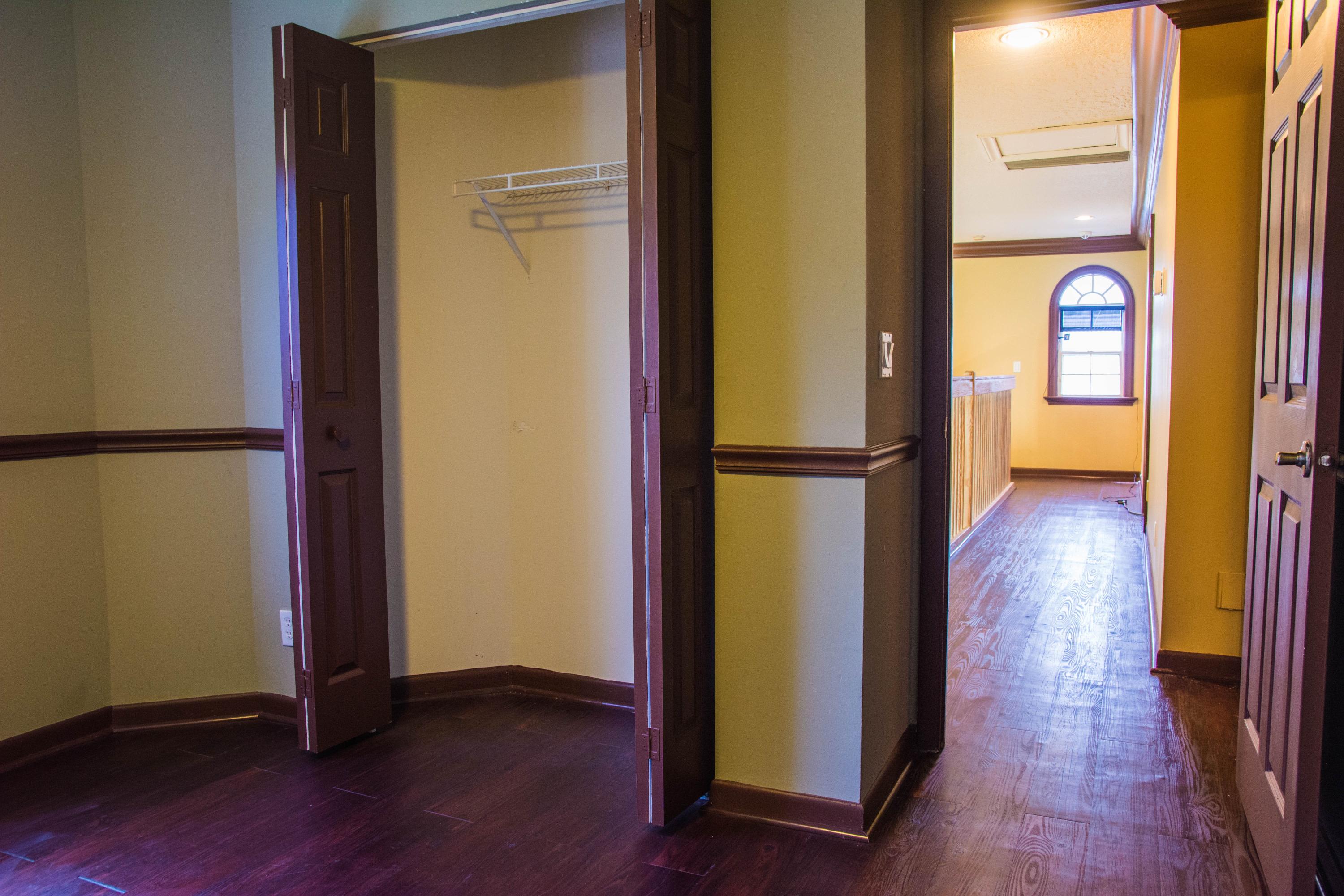 17234 Ventana Drive Boca Raton, FL 33487 - Photo 20 of 27 an empty room with wooden floor and a fireplace