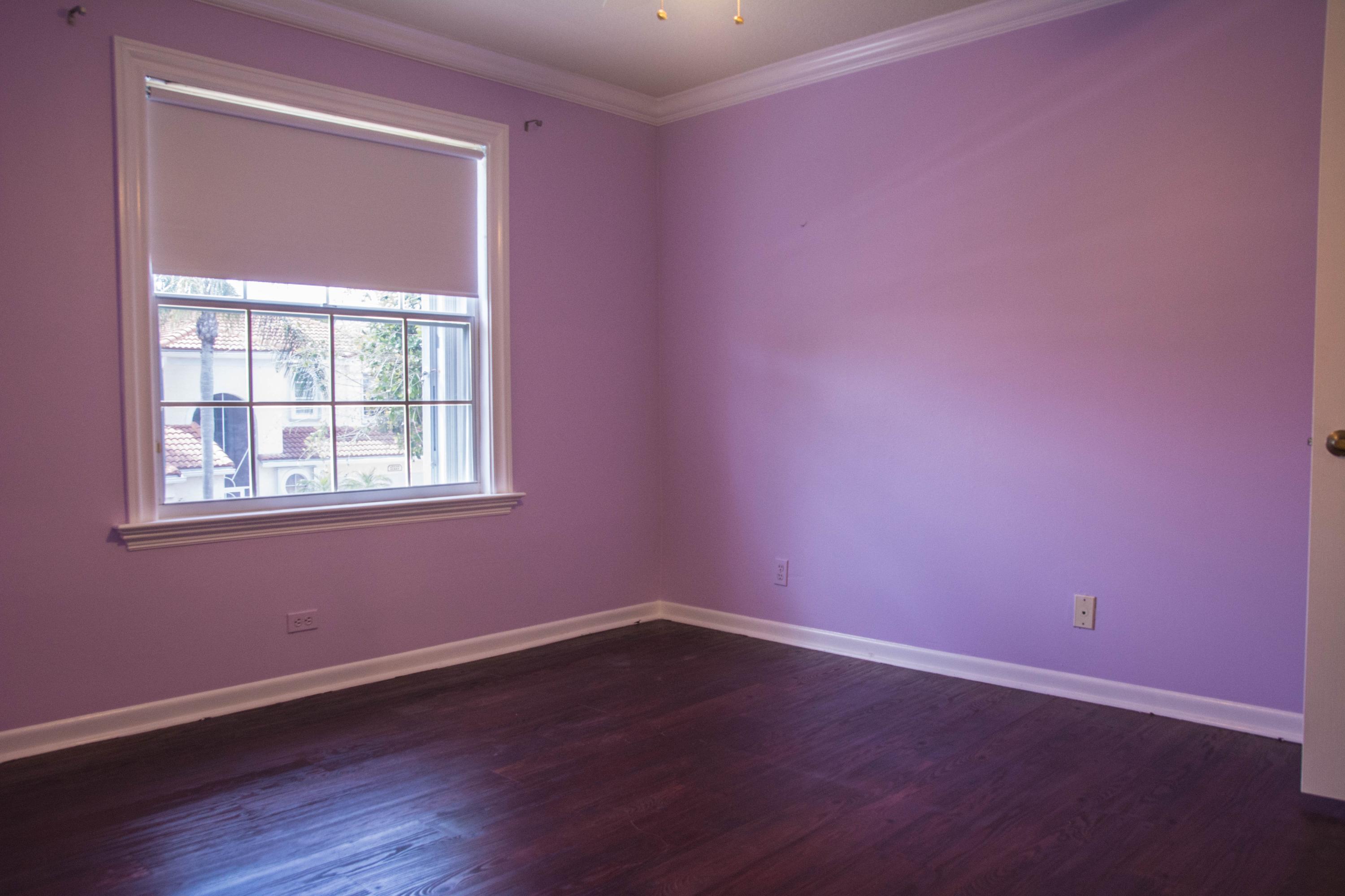 17234 Ventana Drive Boca Raton, FL 33487 - Photo 21 of 27 a view of an empty room with wooden floor and a window